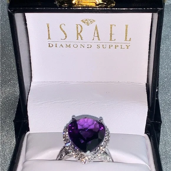 NWpaperwork. Pear Amethyst and round diamond ring.